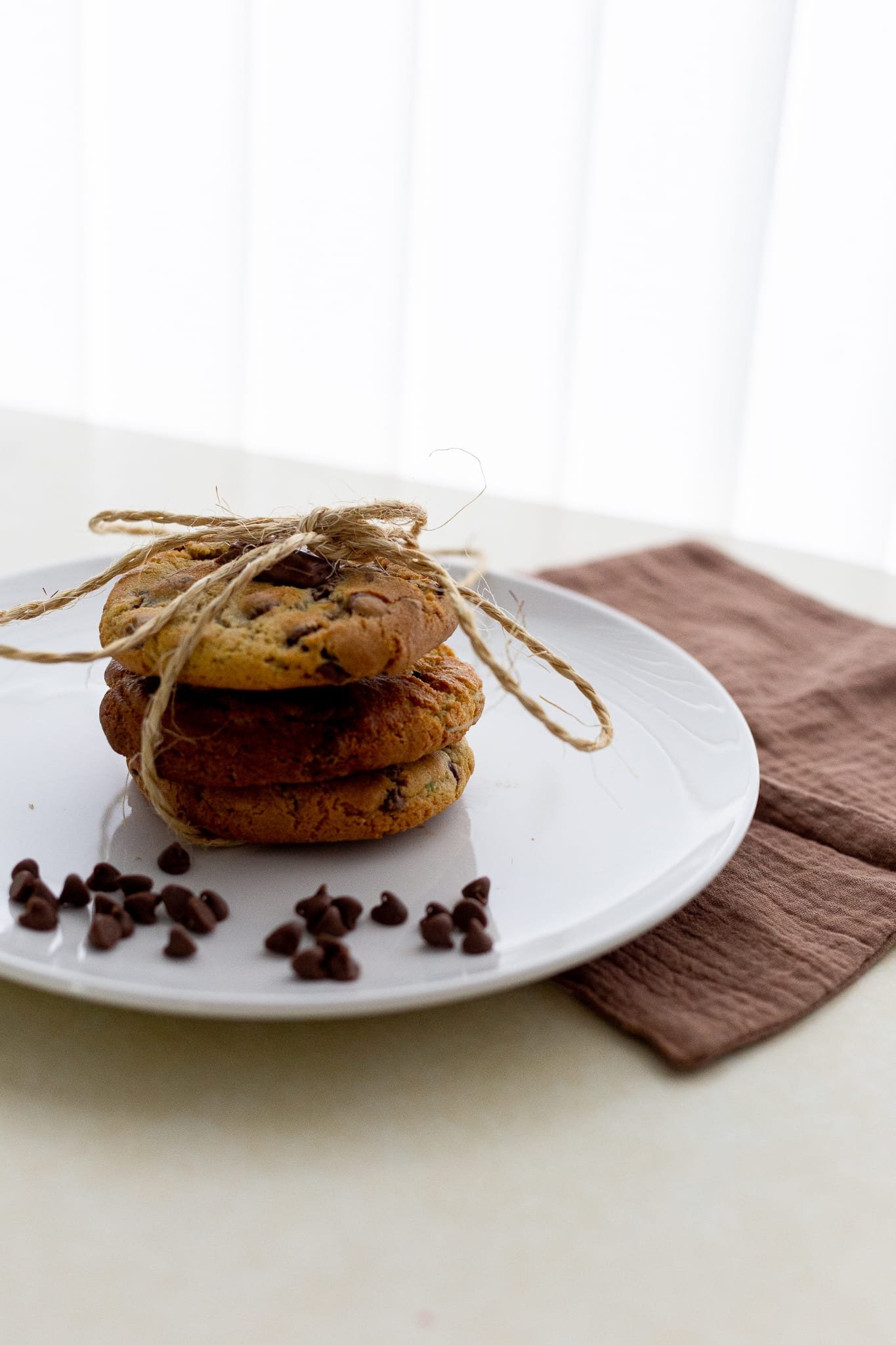 Stack of chocolate chip cookies tied with twine